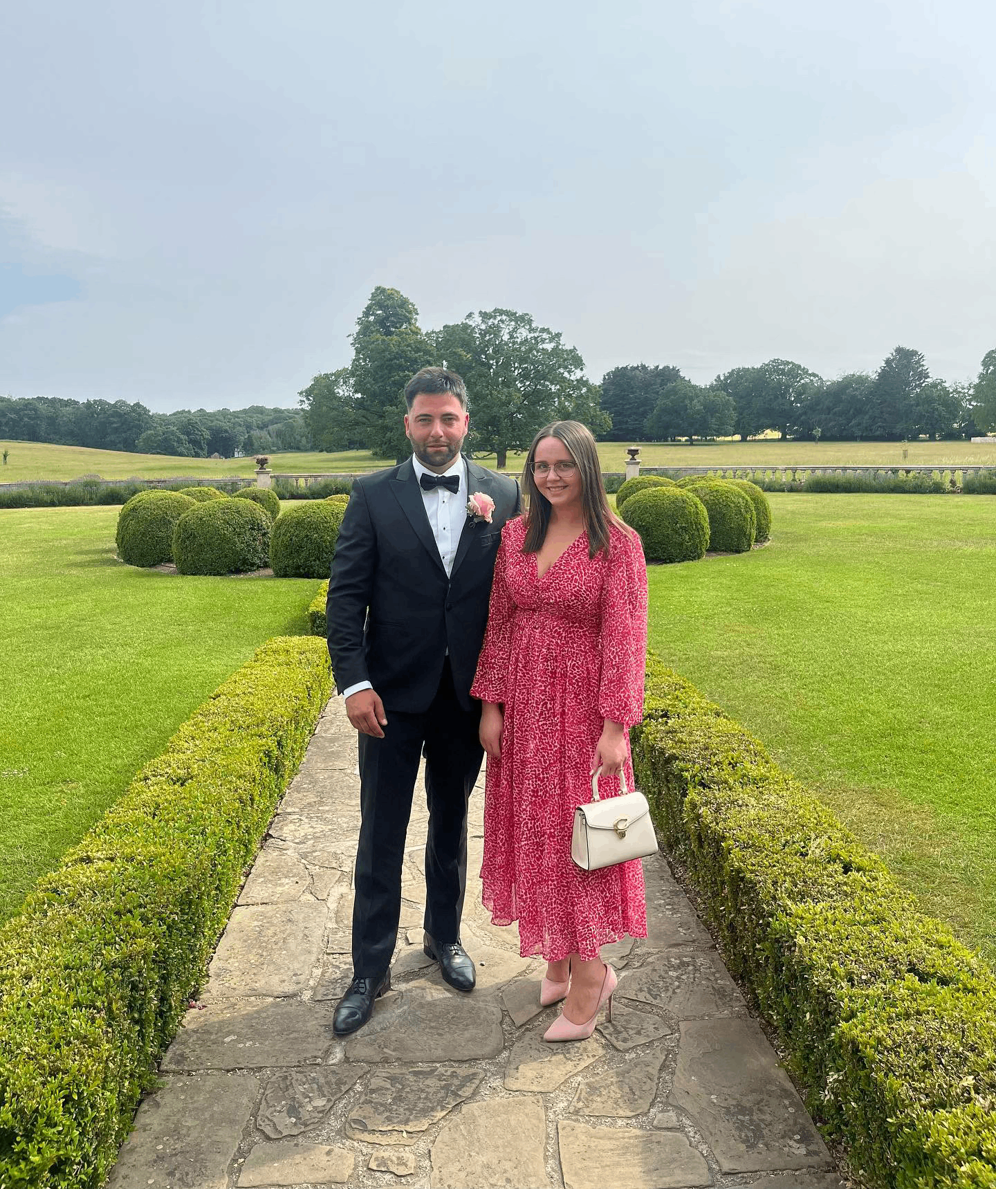 Adem and Fran dressed up at a wedding